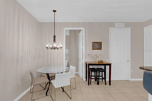 a large kitchen with kitchen island a sink stainless steel appliances and a counter space