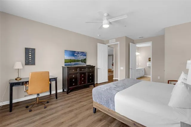 a bathroom with a sink a toilet and shower curtain