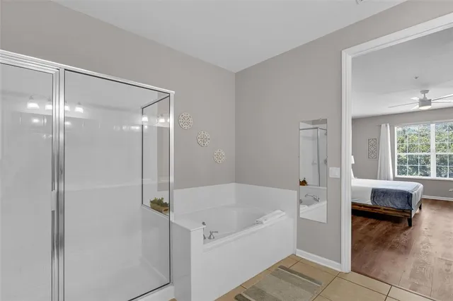 a balcony with furniture and a potted plant