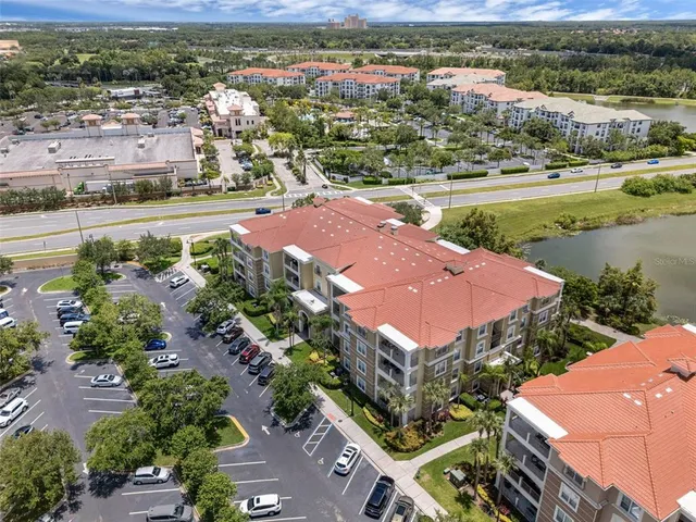 an aerial view of a swimming pool patio and outdoor seating