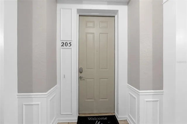 a large kitchen with a large counter top appliances and cabinets