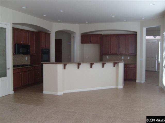 10075 Bull Rider Court Reno, NV 89521 - Photo 3 of 9 a utility room with cabinets