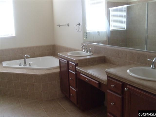 10075 Bull Rider Court Reno, NV 89521 - Photo 5 of 9 a bathroom with a sink and a bathtub