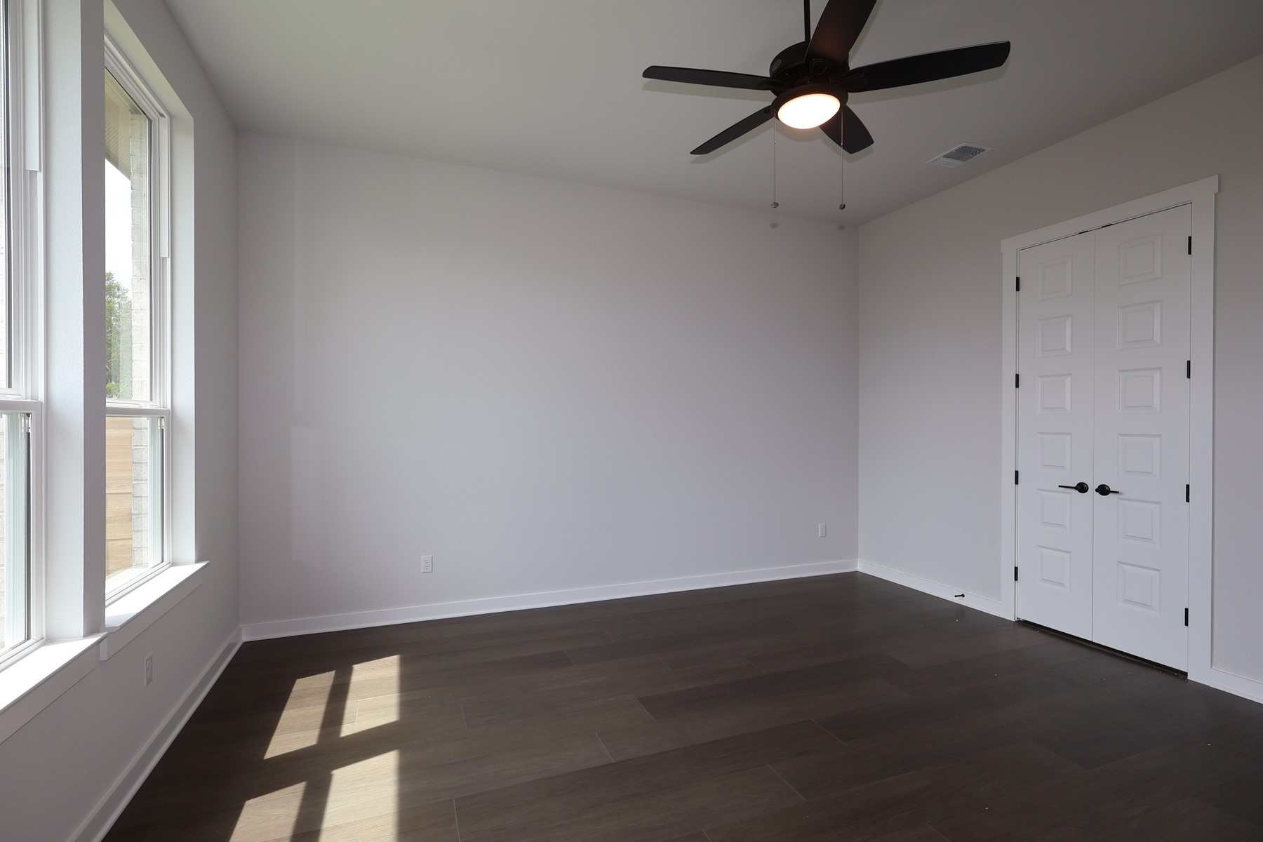 436 Leaning Rock Road Georgetown, TX 78628 - Photo 12 of 22 wooden floor in an empty room with a window