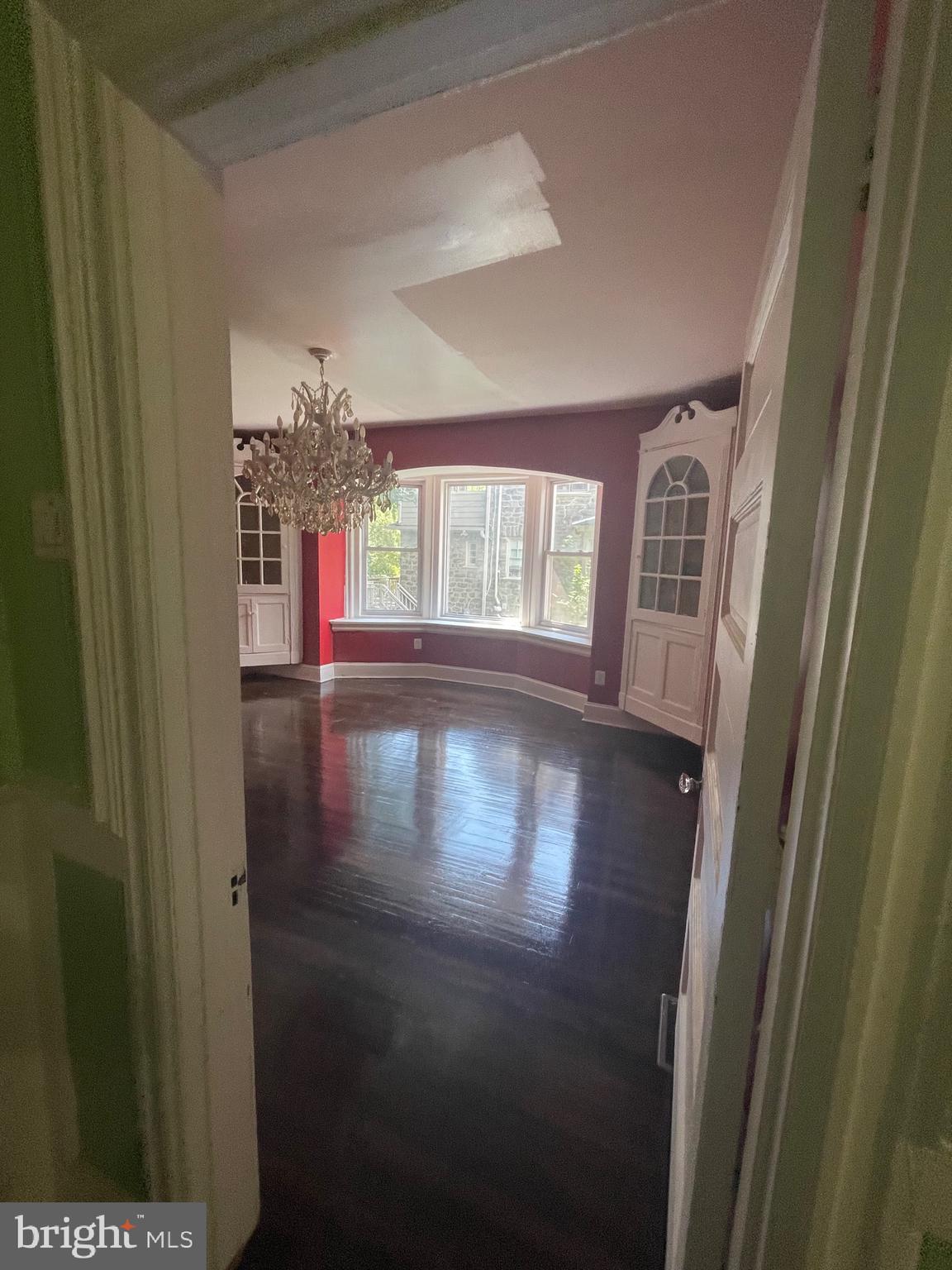 6416 Overbrook Avenue Philadelphia, PA 19151 - Photo 5 of 18 a view of empty room with wooden floor and fan