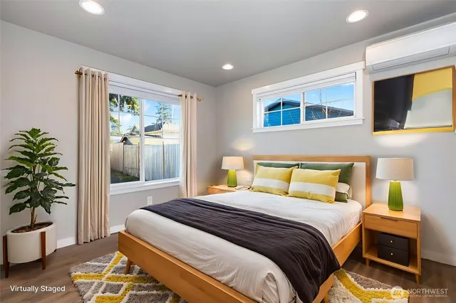 a bedroom with a bed and a potted plant