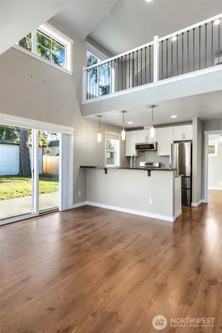 a view of a kitchen with a sink and a stove top oven