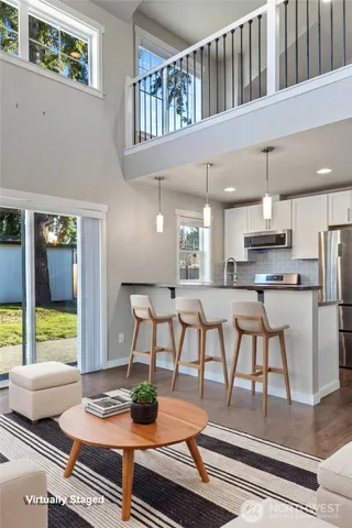 a view of kitchen with furniture and large window