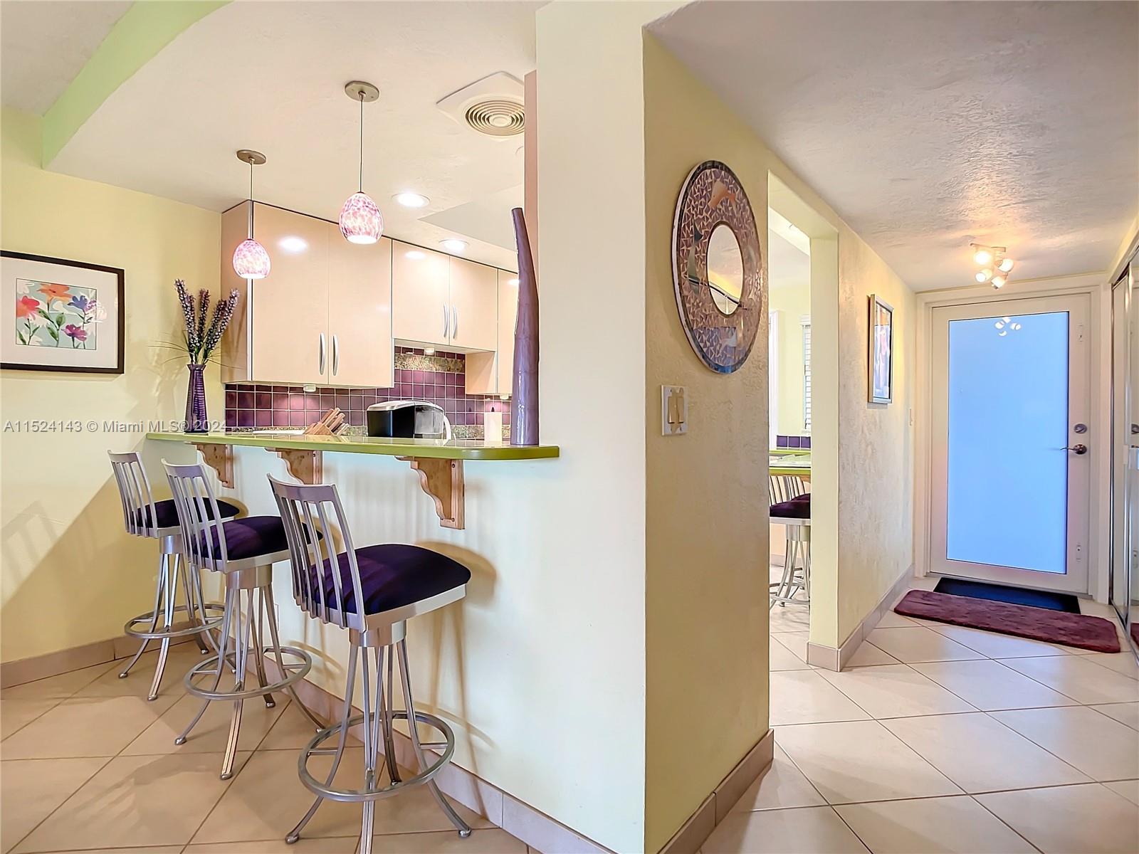 320 South Surf Road, Unit 506 Hollywood, FL 33019 - Photo 11 of 36 a view of dining room and kitchen with stainless steel appliances