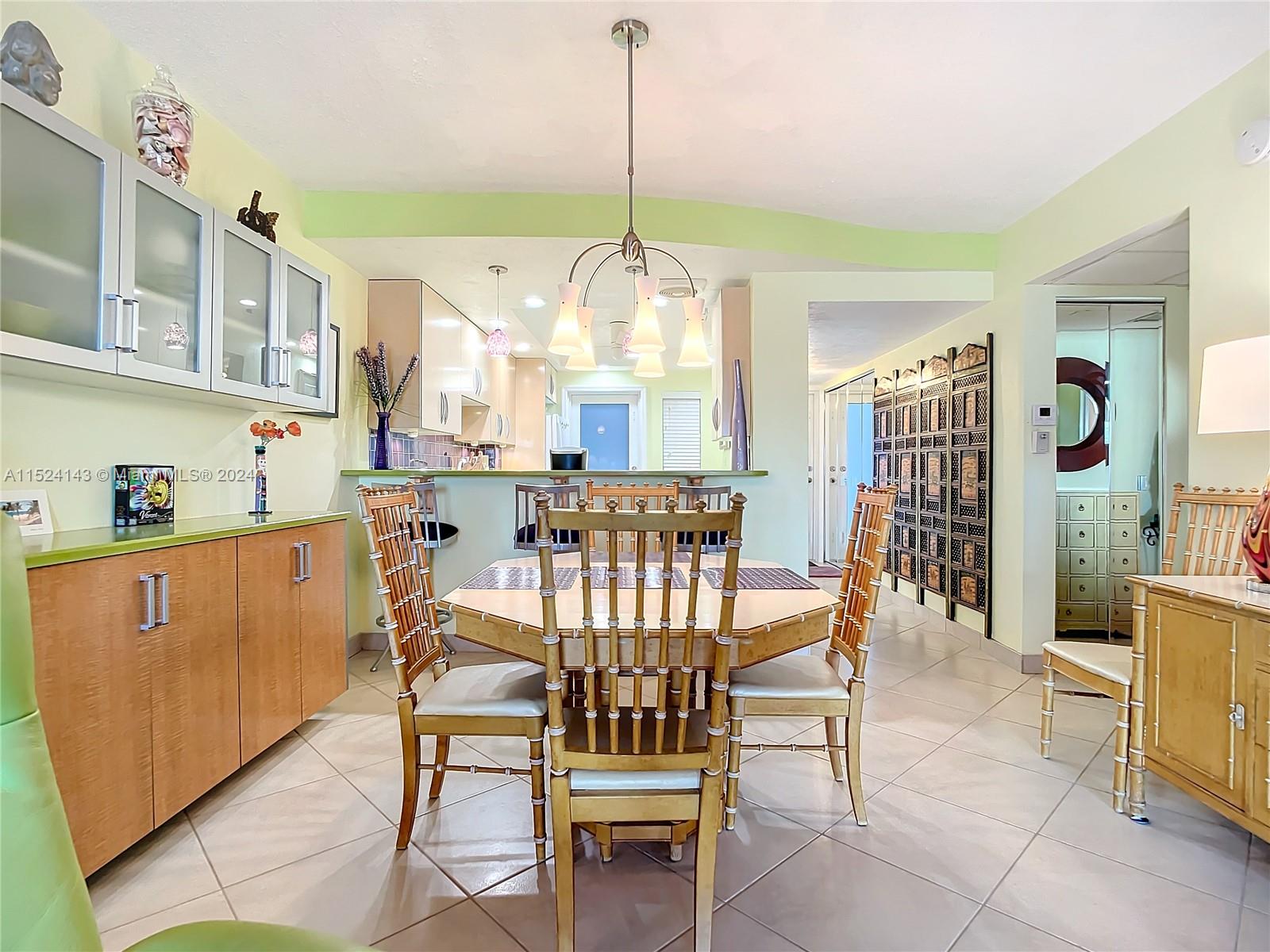320 South Surf Road, Unit 506 Hollywood, FL 33019 - Photo 13 of 36 a view of a dining room with furniture