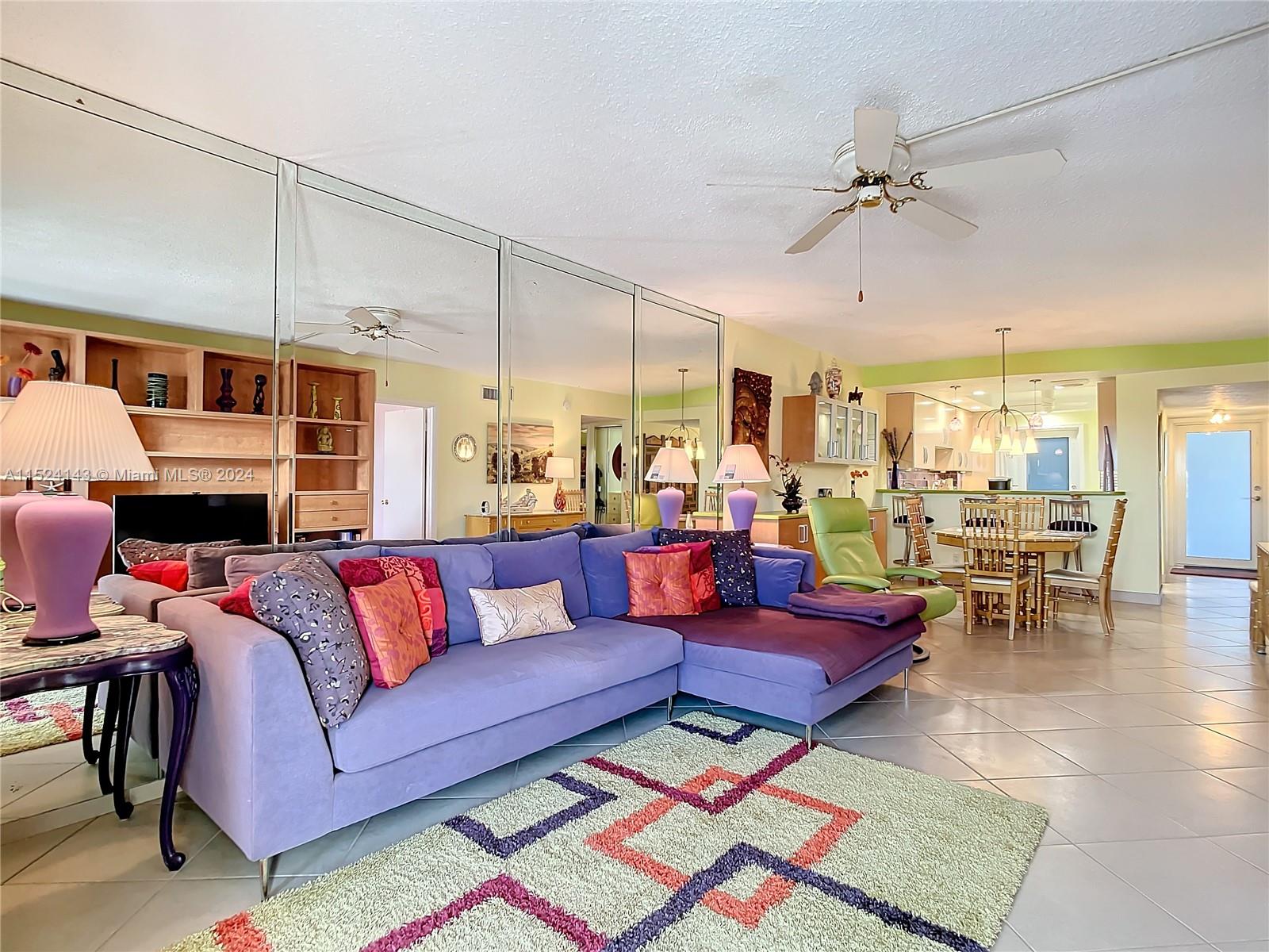 320 South Surf Road, Unit 506 Hollywood, FL 33019 - Photo 20 of 36 a living room with furniture and a view of kitchen