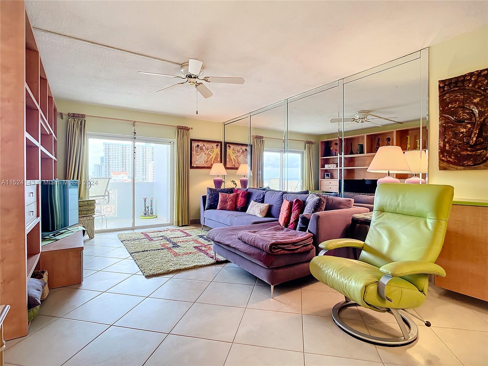 320 South Surf Road, Unit 506 Hollywood, FL 33019 - Photo 21 of 36 a living room with furniture and a flat screen tv