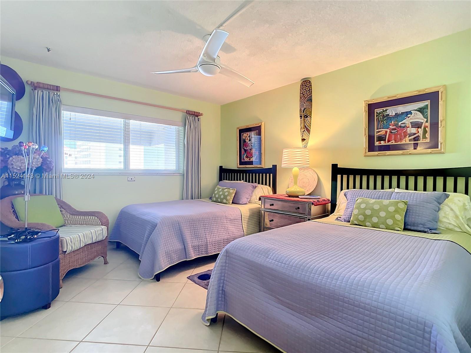 320 South Surf Road, Unit 506 Hollywood, FL 33019 - Photo 25 of 36 a bedroom with two beds and a window