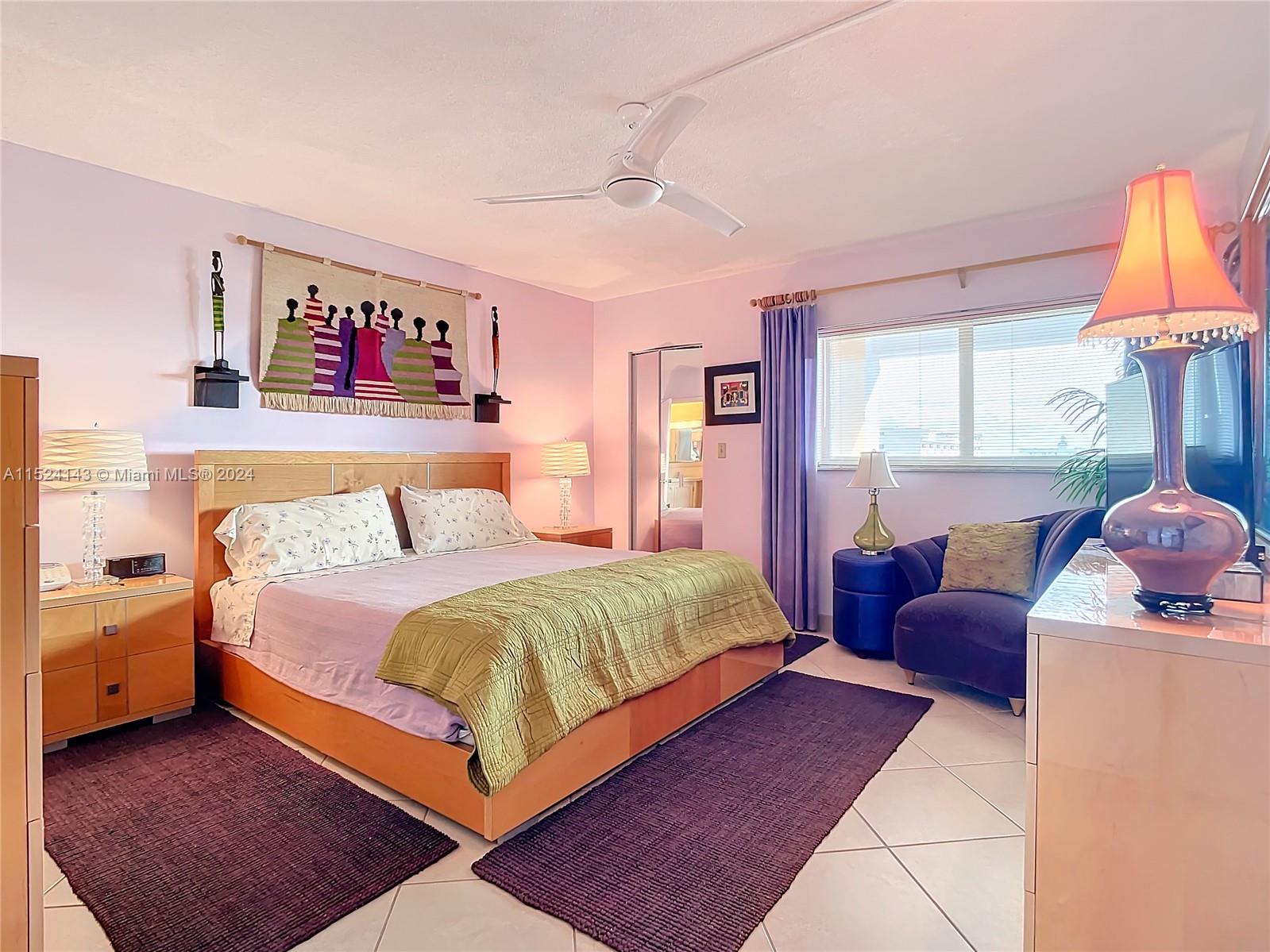 320 South Surf Road, Unit 506 Hollywood, FL 33019 - Photo 26 of 36 a bedroom with a bed and a window