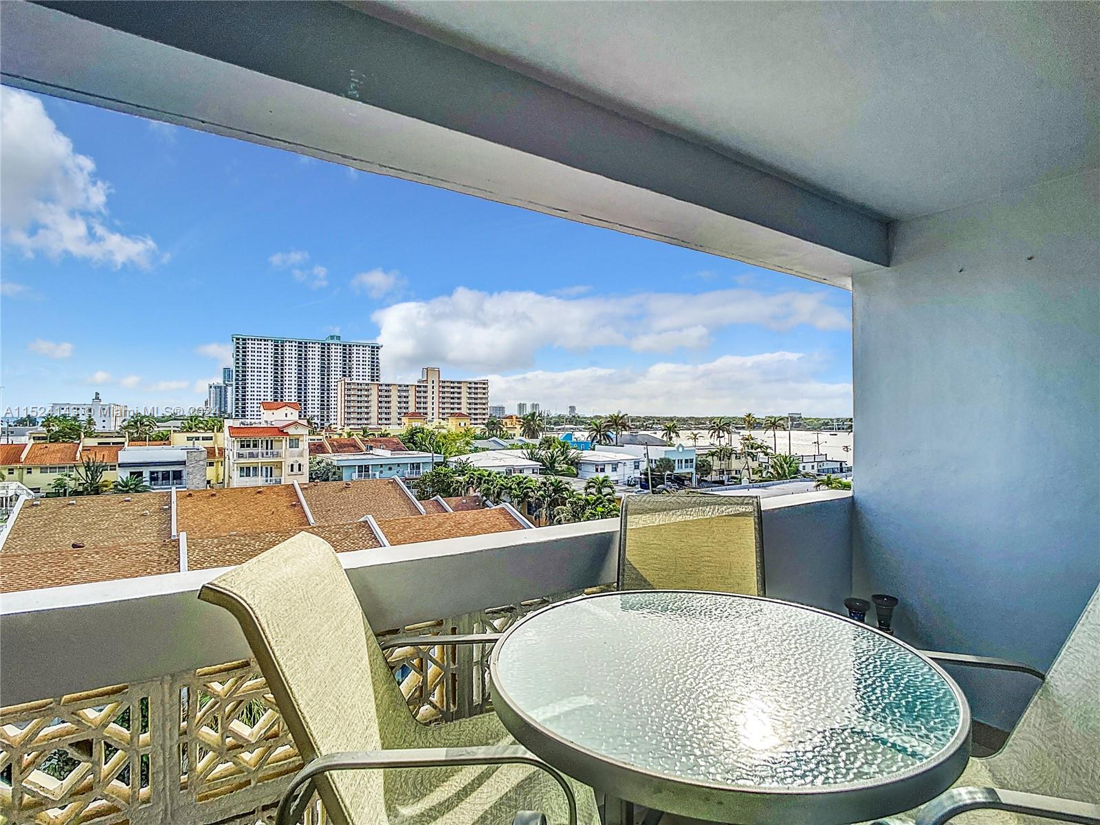 320 South Surf Road, Unit 506 Hollywood, FL 33019 - Photo 30 of 36 a very nice looking dining room with a table and chairs