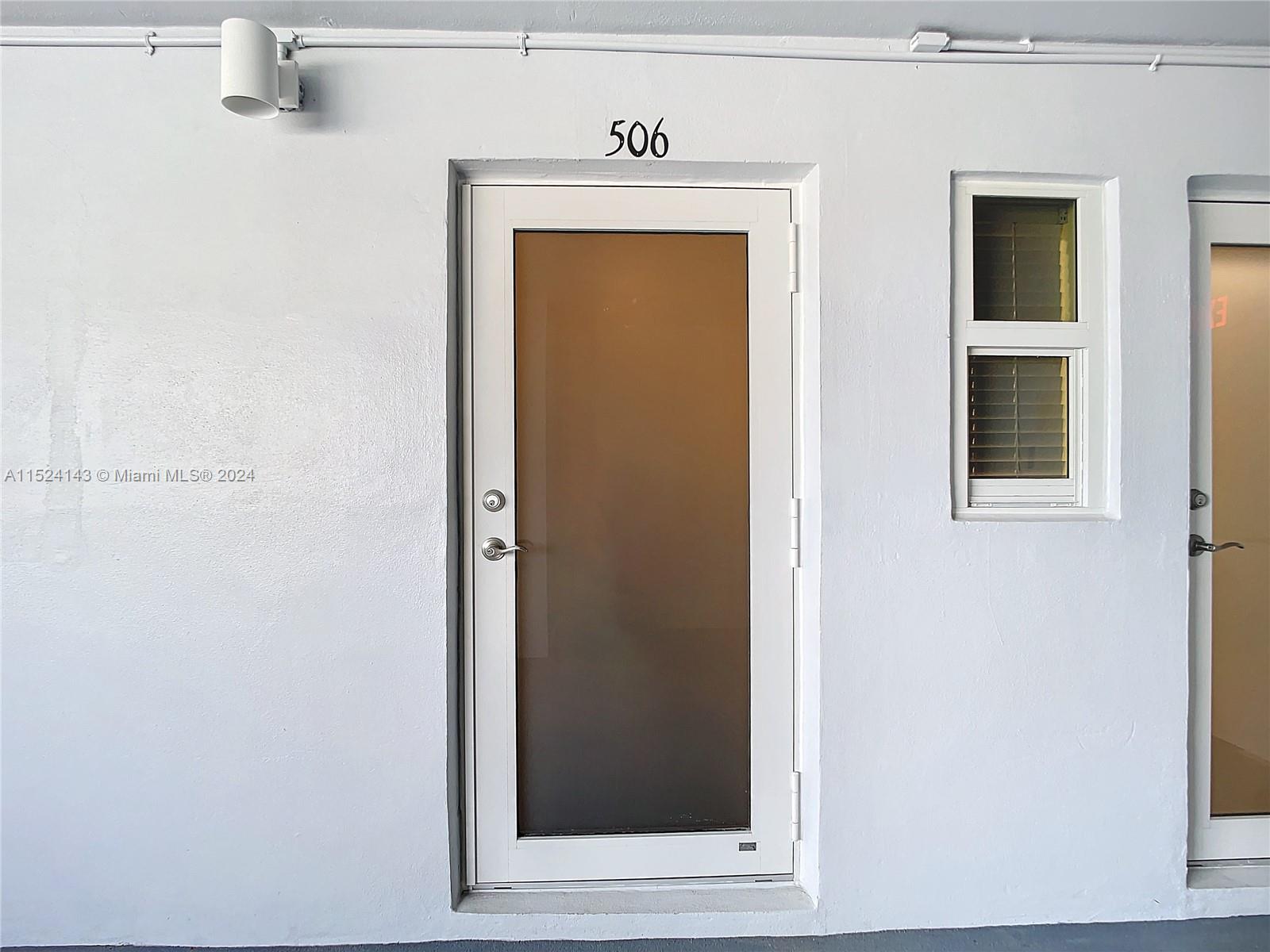 320 South Surf Road, Unit 506 Hollywood, FL 33019 - Photo 3 of 36 a view of a hallway with wooden door
