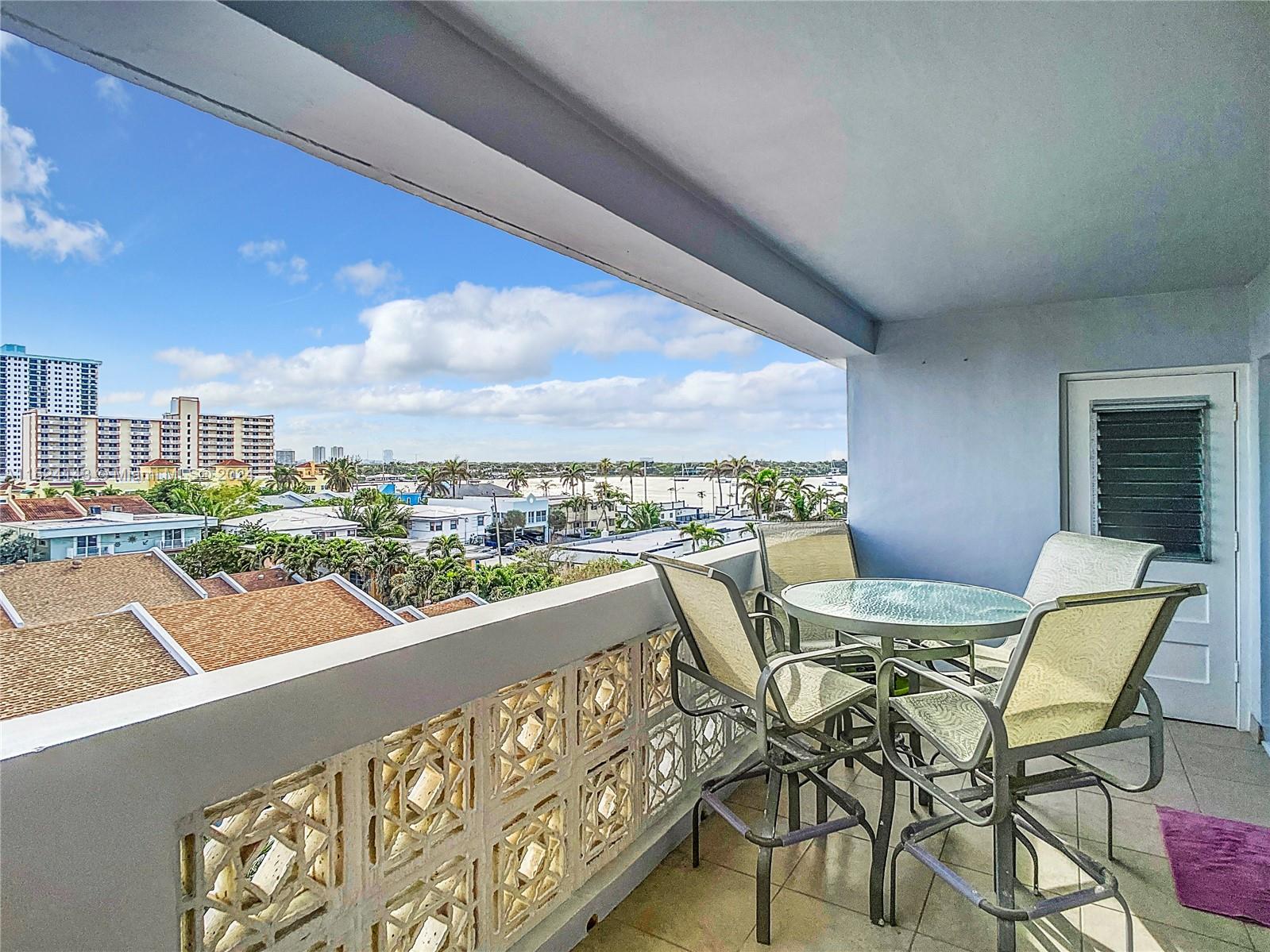 320 South Surf Road, Unit 506 Hollywood, FL 33019 - Photo 32 of 36 a view of a chairs and table in patio