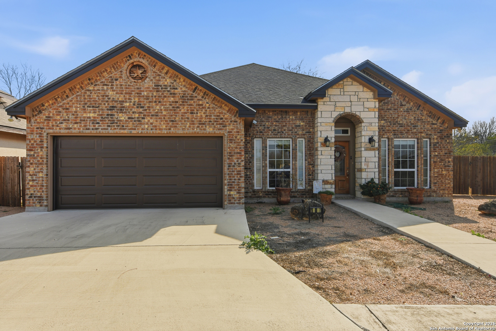 101 Sutton Place Uvalde, TX 78801 - Photo 14 of 36 a front view of a house with garden