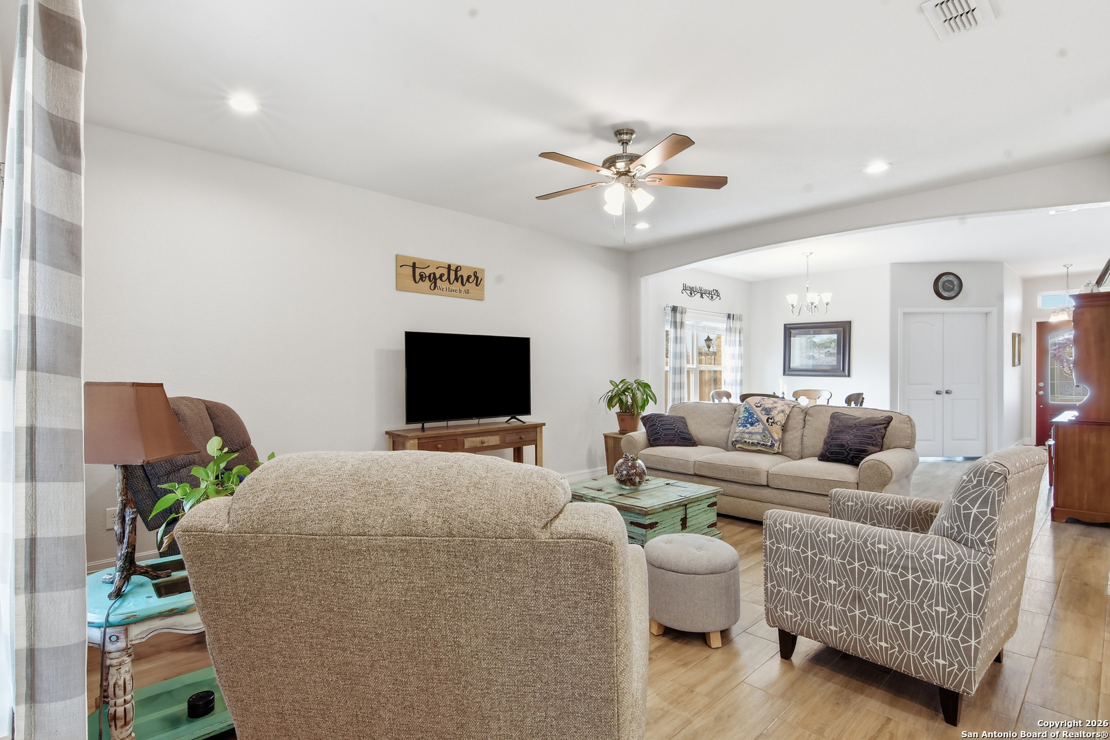 101 Sutton Place Uvalde, TX 78801 - Photo 16 of 36 a living room with furniture and a flat screen tv