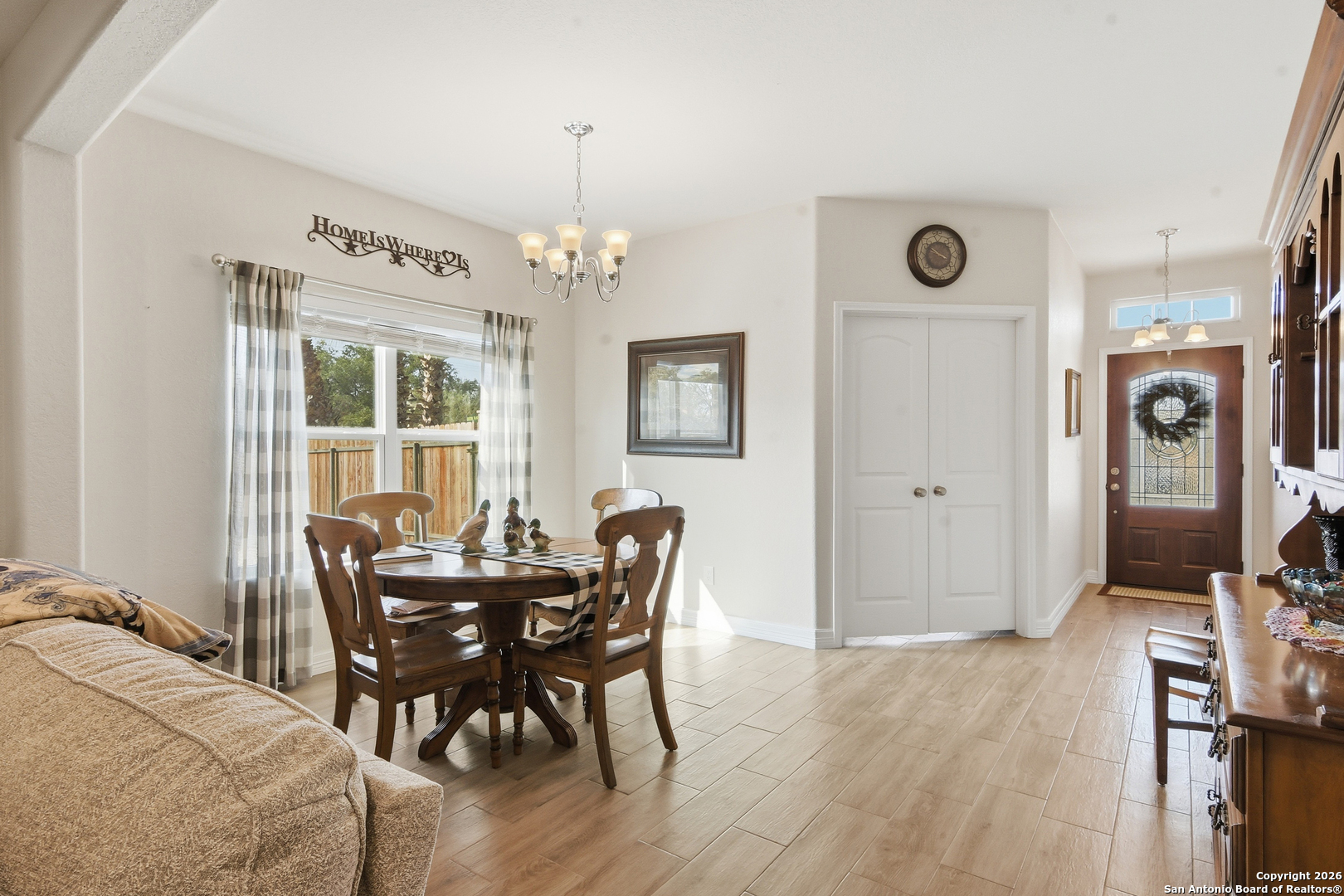 101 Sutton Place Uvalde, TX 78801 - Photo 20 of 36 a view of a dining room with furniture and wooden floor