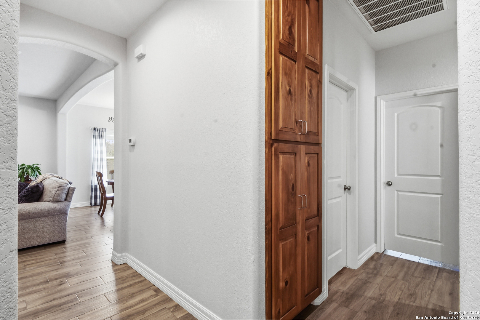 101 Sutton Place Uvalde, TX 78801 - Photo 25 of 36 a view of a hallway view with wooden floor and furniture