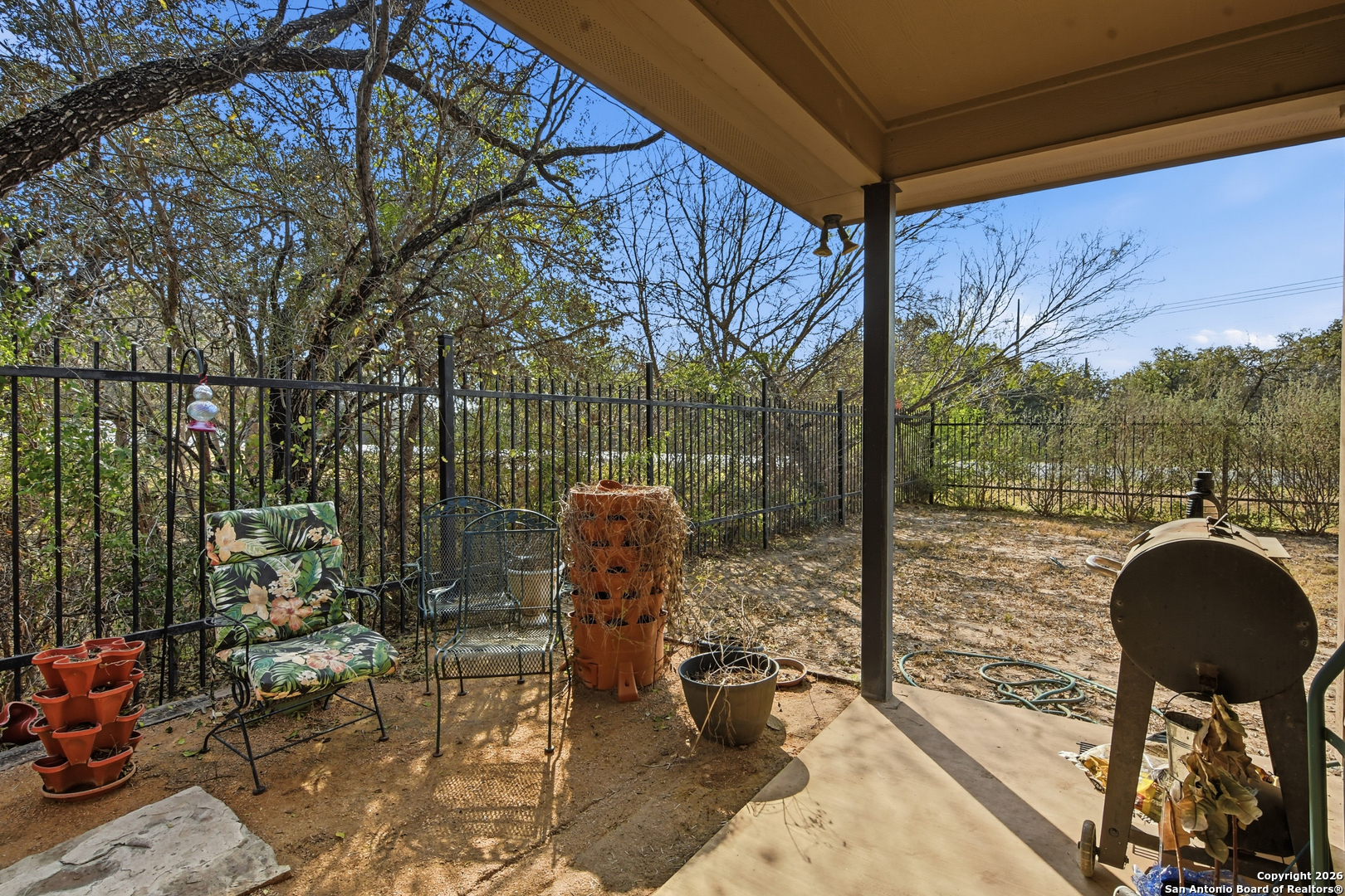 101 Sutton Place Uvalde, TX 78801 - Photo 35 of 36 a view of a chair and tables in the patio