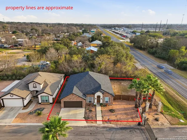 an aerial view of a house with a garden