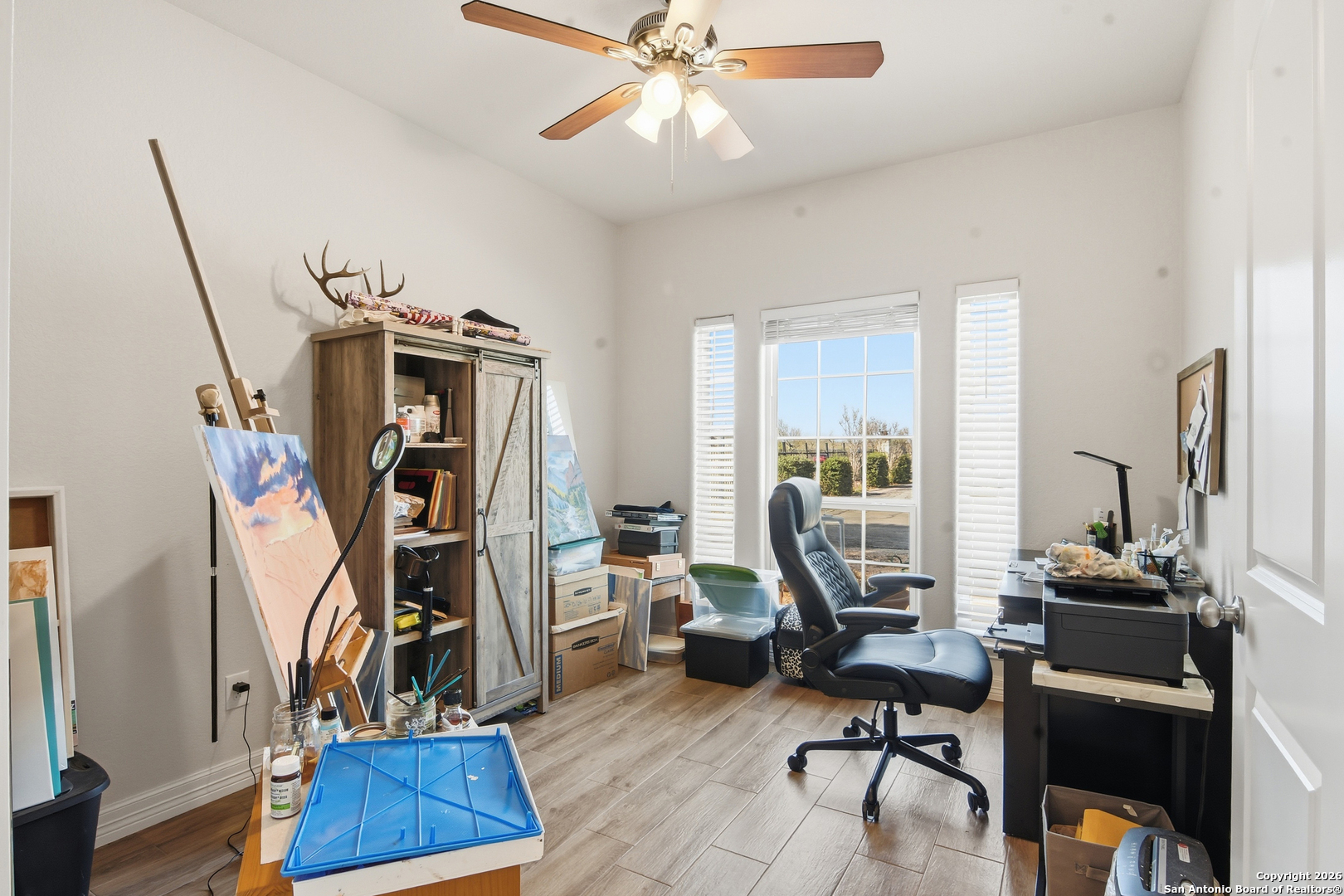 101 Sutton Place Uvalde, TX 78801 - Photo 10 of 36 a view of a workspace with furniture and a window