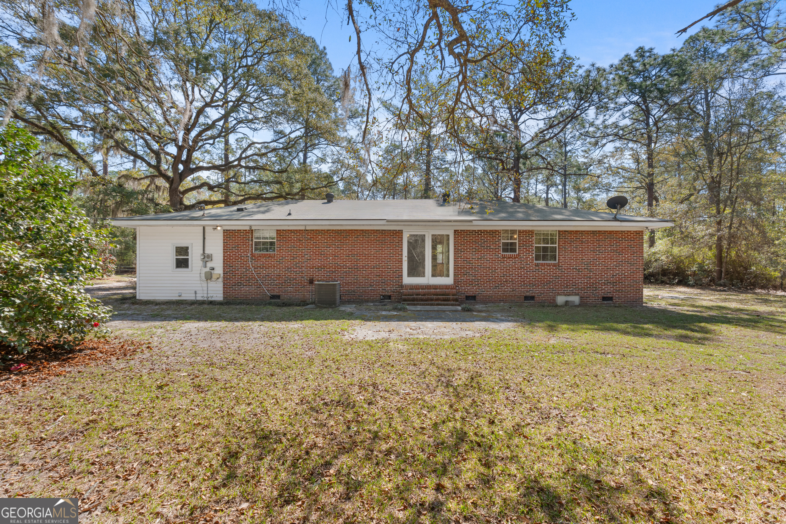 181 Heidt Road Guyton, GA 31312 - Photo 19 of 24 front view of house with a trees