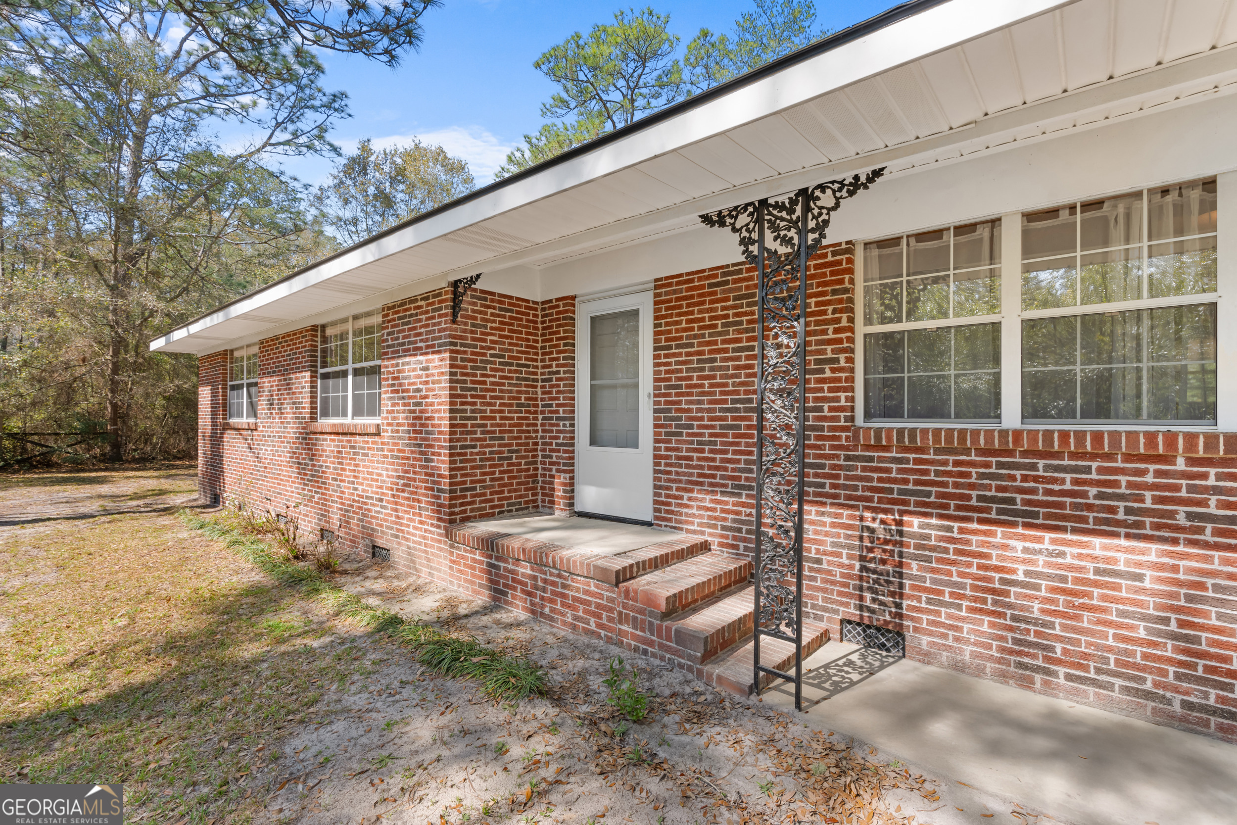 181 Heidt Road Guyton, GA 31312 - Photo 2 of 24 a front view of a house with a yard
