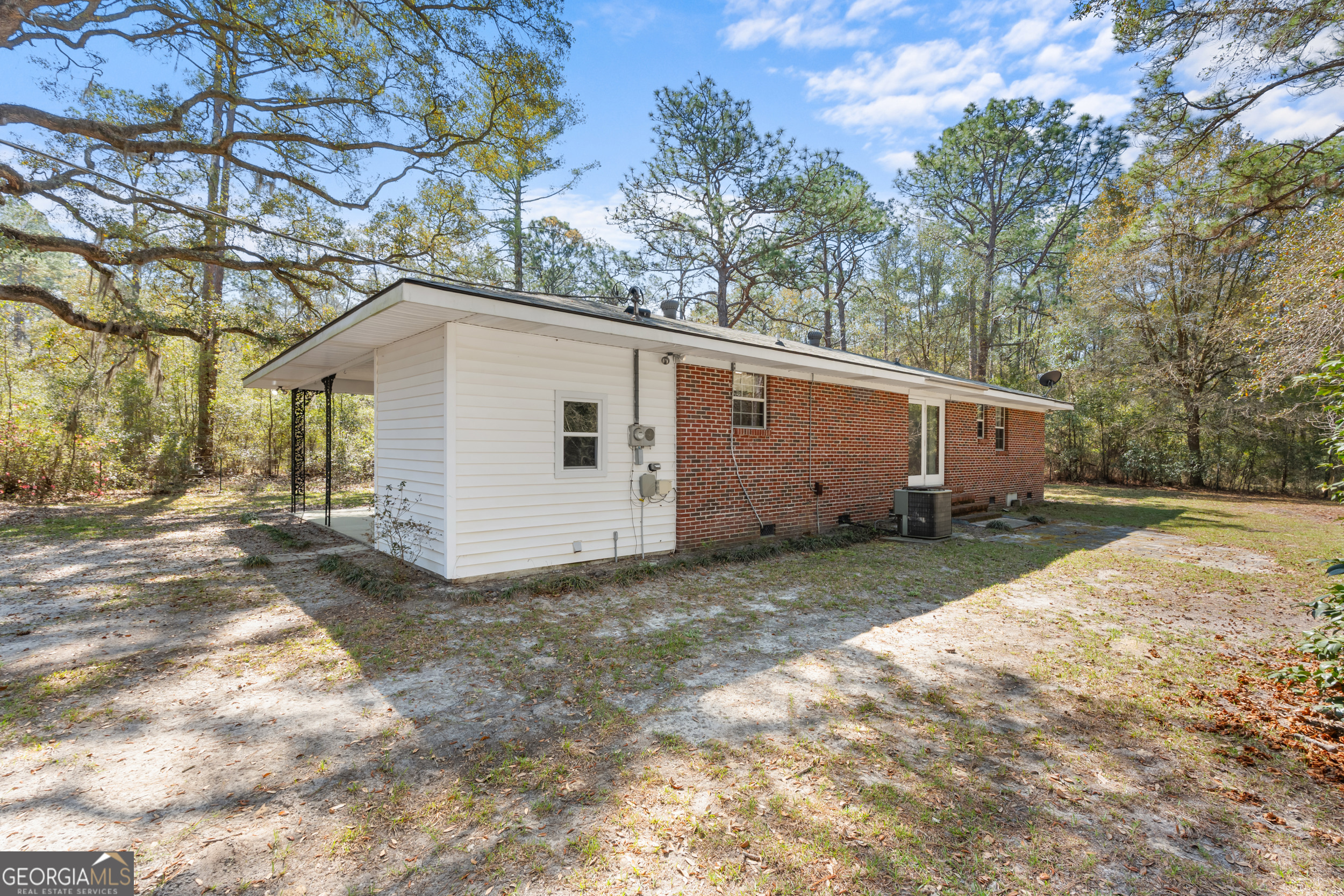 181 Heidt Road Guyton, GA 31312 - Photo 24 of 24 a view of a house with a yard