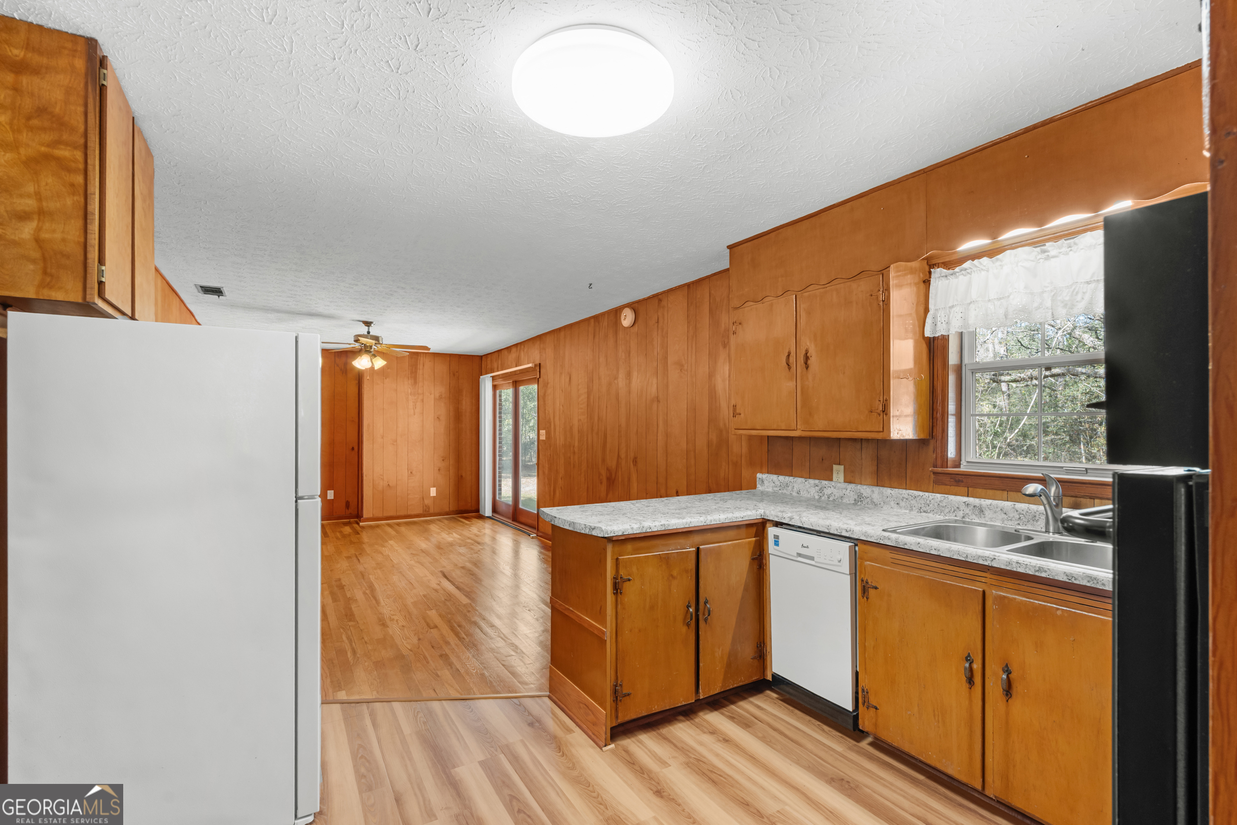 181 Heidt Road Guyton, GA 31312 - Photo 8 of 24 a kitchen with a sink and cabinets