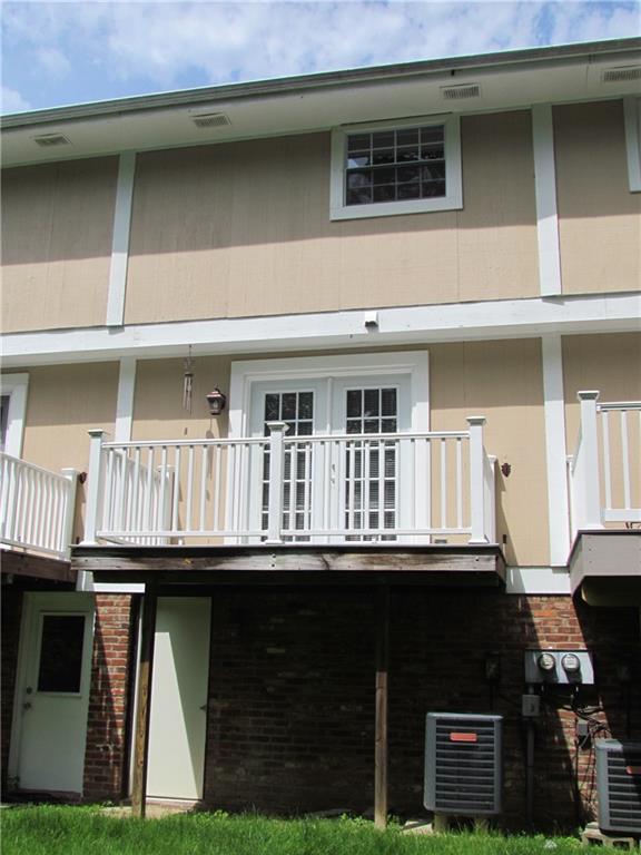 5491 Library Road, Unit 21 Bethel Park, PA 15102 - Photo 23 of 25 REAR EXTERIOR OF THE HOME - - -SECOND BEDROOM WINDOW, DECK AND FRENCH DOOR OFF OF THE LIVING ROOM, AND THE WALK OUT DOOR FROM THE BASEMENT
