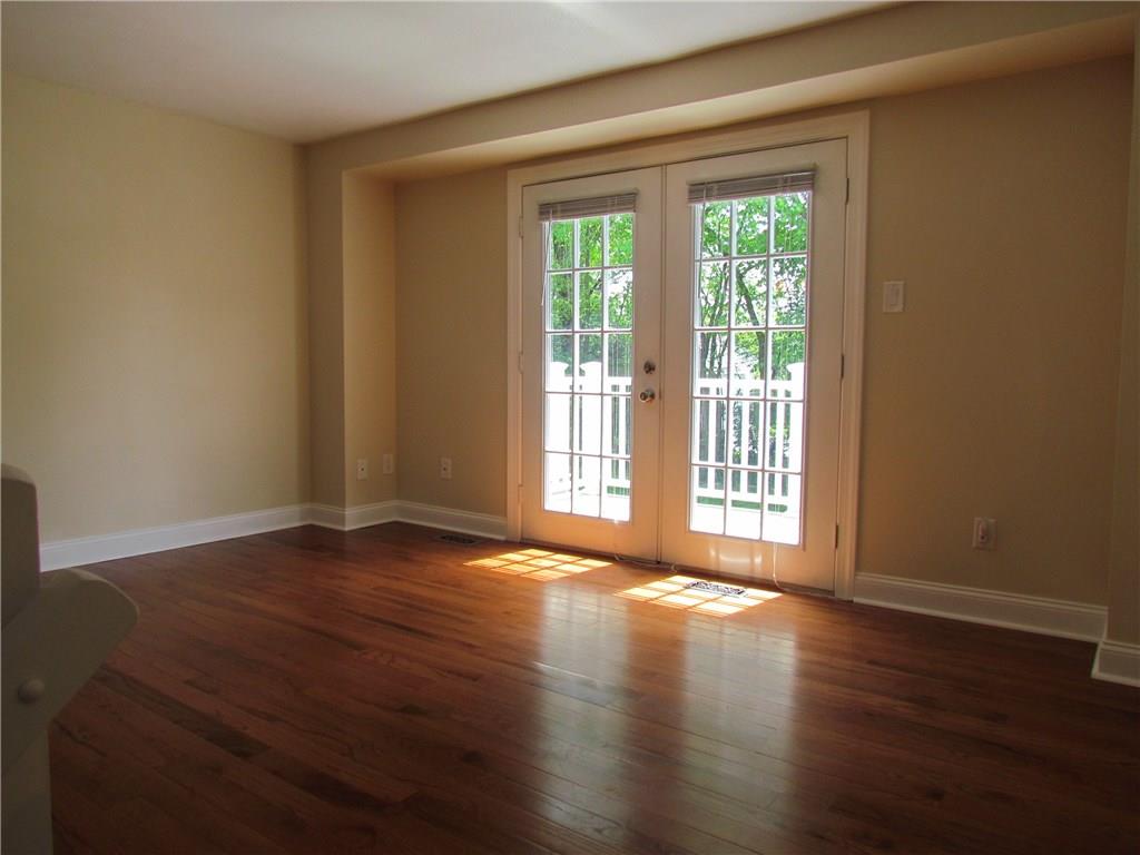 5491 Library Road, Unit 21 Bethel Park, PA 15102 - Photo 6 of 25 FRENCH DOOR LEADING OUT OF THE LIVING ROOM...