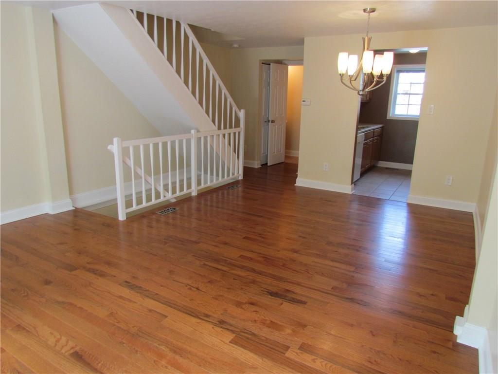 5491 Library Road, Unit 21 Bethel Park, PA 15102 - Photo 7 of 25 ANOTHER VIEW OF THE LIVING AND DINING ROOMS- NOTICE HOW BRIGHT - LOTS OF NATURAL LIGHT --- KITCHEN, HALF BATH, AND STAIRS TO THE UPPER FLOOR JUST AHEAD...