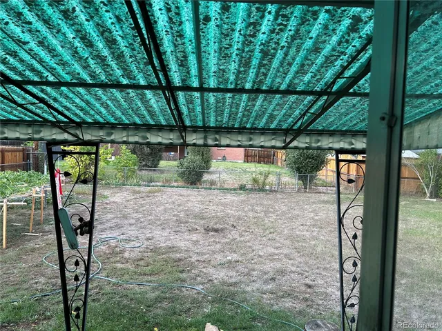 a backyard of a house with a garden view