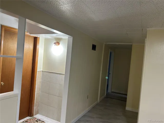 a view of bathroom with mirror