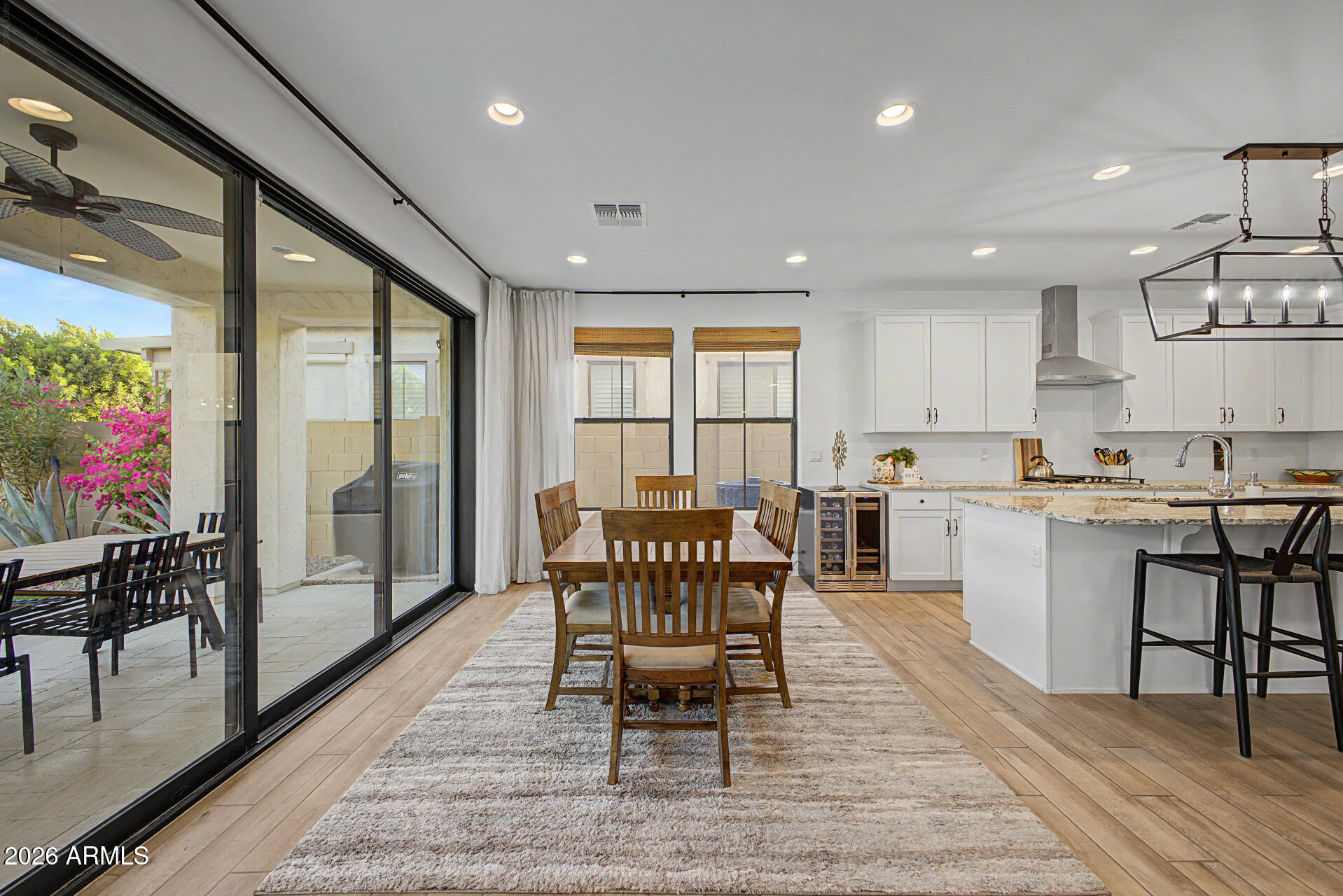 819 West Deer Creek Road Phoenix, AZ 85048 - Photo 24 of 76 a view of a dining room with furniture window and wooden floor