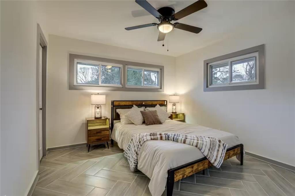 1944 Cindy Drive Decatur, GA 30032 - Photo 15 of 22 a bedroom with a bed and a ceiling fan