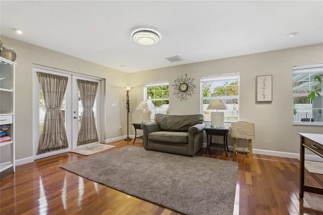 a view of a dining room with furniture and window