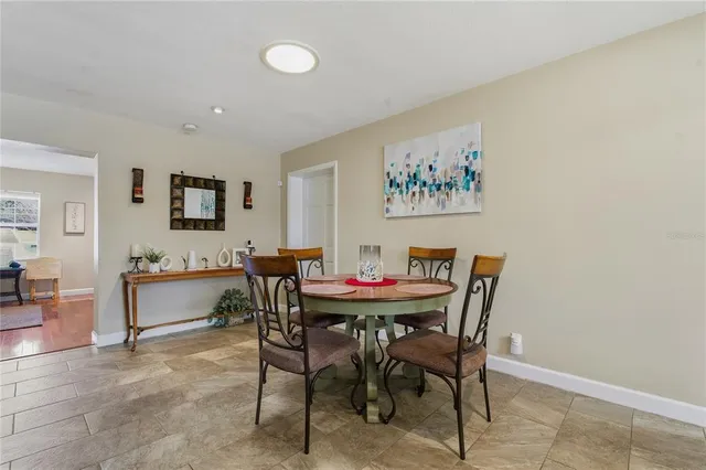 a kitchen with stainless steel appliances granite countertop a sink and dishwasher a refrigerator with wooden cabinets