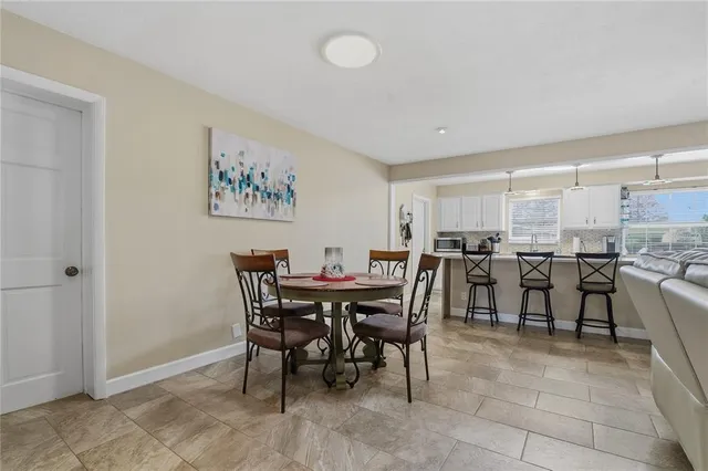 a kitchen with cabinets and stainless steel appliances