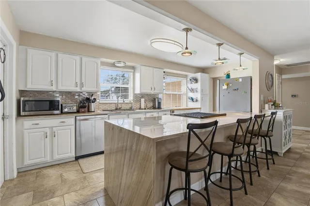 a view of a hallway with wooden floor and closet