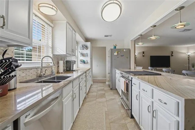 a bedroom with a large bed and a tv