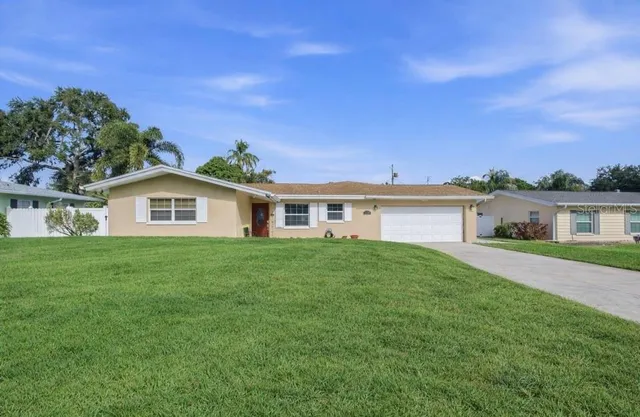 a view of a house with a big yard