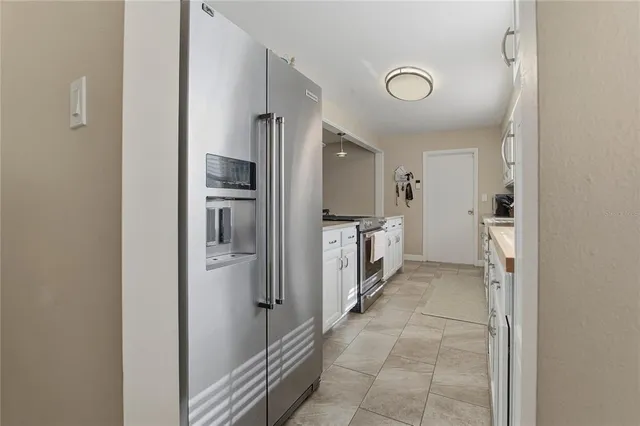 a bathroom with a double vanity sink a mirror and shower