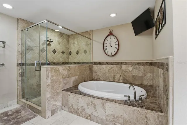 a view of a backyard with plants and a patio