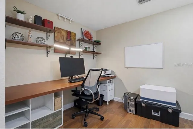 a view of a house with a yard porch and sitting area