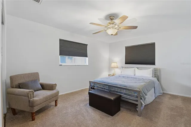 an aerial view of a house with outdoor space