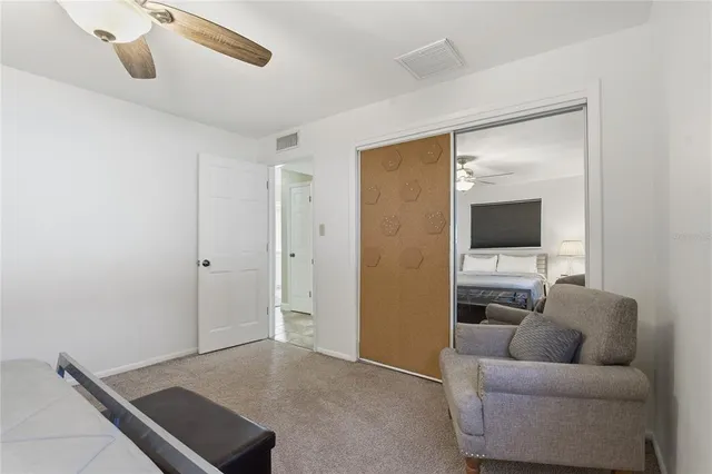 an aerial view of a house with garden space and lake view